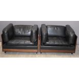 Pair of retro mid century Italian designer armchairs with hardwood frames and black leather