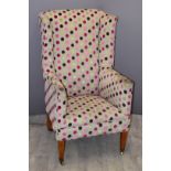 Polka dot upholstered wing back armchair