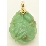 A 14k gold pendant set with carved quartz / jadeite depicting a pear and foliage, 27.9g, 4.7cm