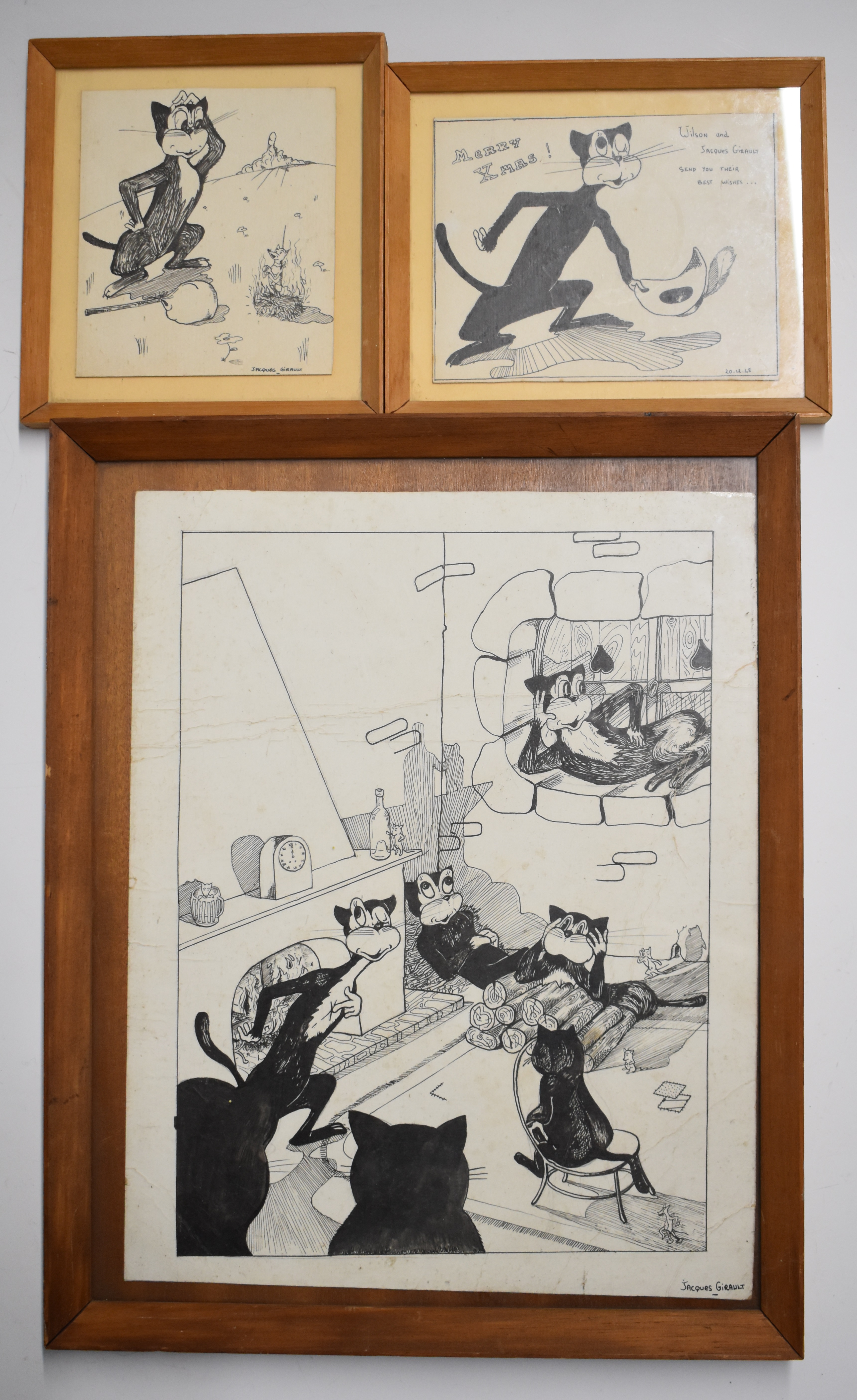 Jacques Girault three pen and ink novelty cat drawings or cartoons, two signed lower right the other