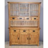 Contemporary solid oak dresser with seven drawers, cupboards and cubby holes, W140 x D42 x H191cm