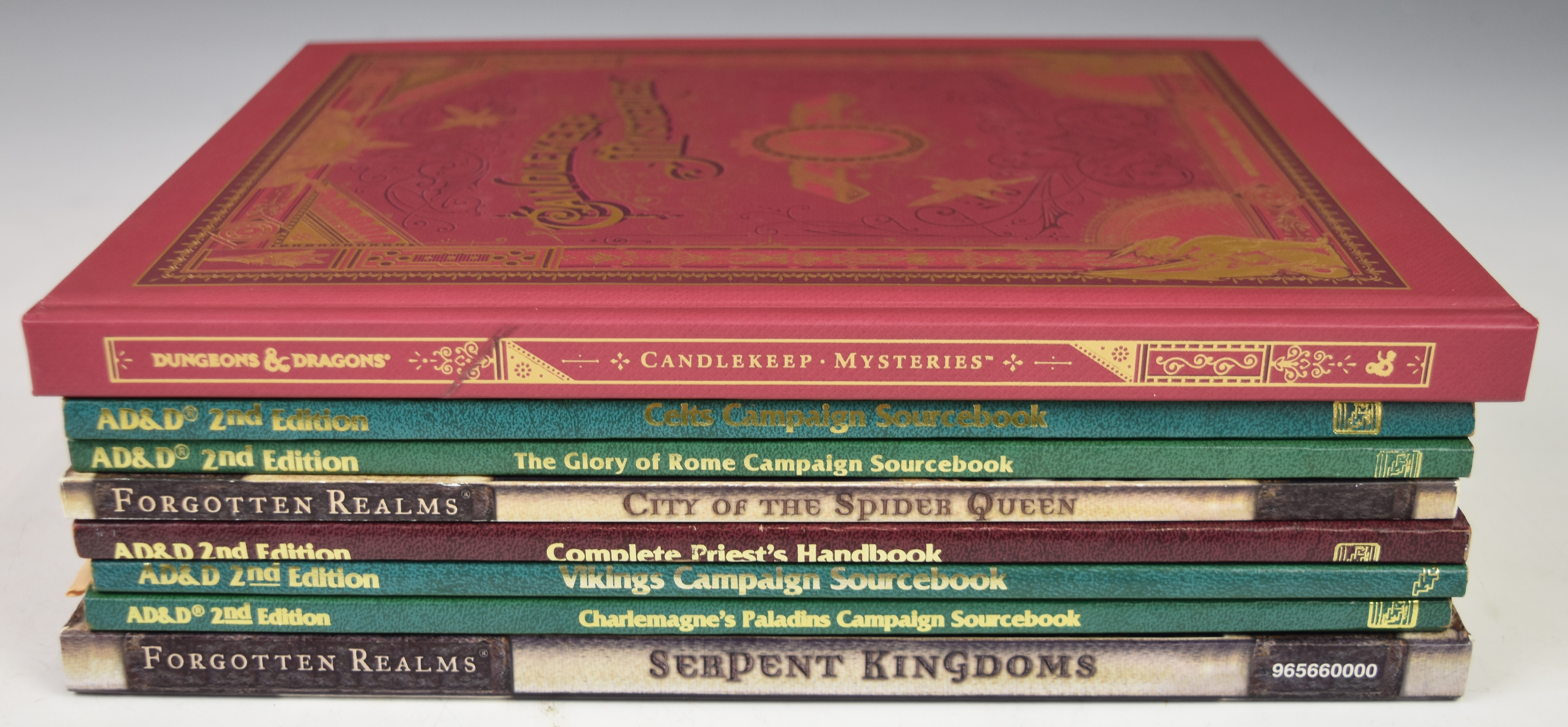 Dungeons and Dragons Candlekeep Mysteries by Wizards of The Coast together with 7 AD&D sourcebooks.