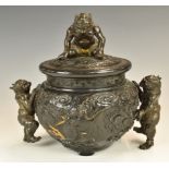 Japanese Meiji period bronze koro and cover with dragon decoration in relief, Greek key design rim
