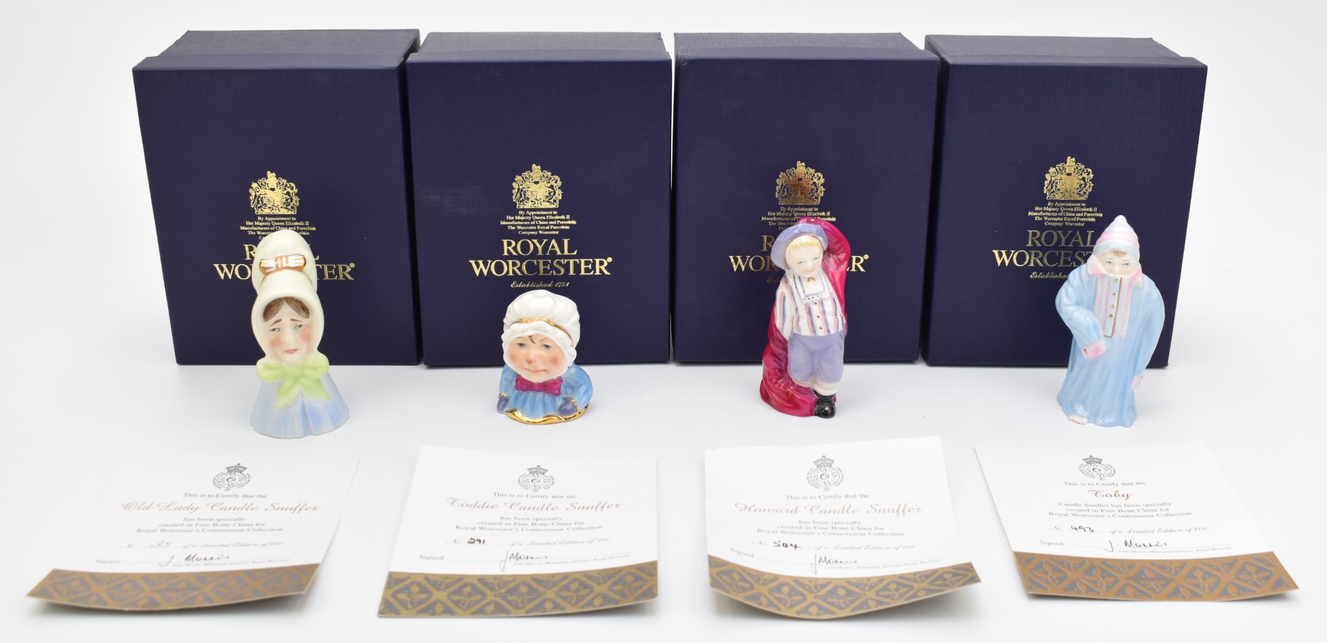 Four limited edition Royal Worcester candle snuffers comprising Toddie, Old Lady, baby and Howard,