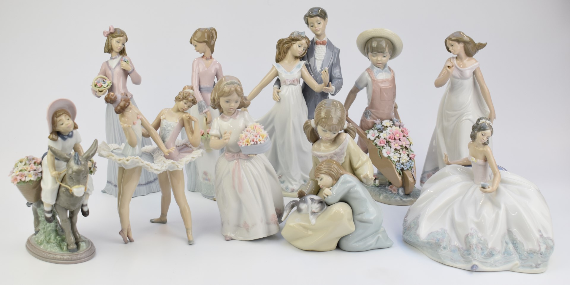 Ten Lladro figures including Afternoon Promenade, Dress Rehearsal etc, all boxed, tallest 25cm