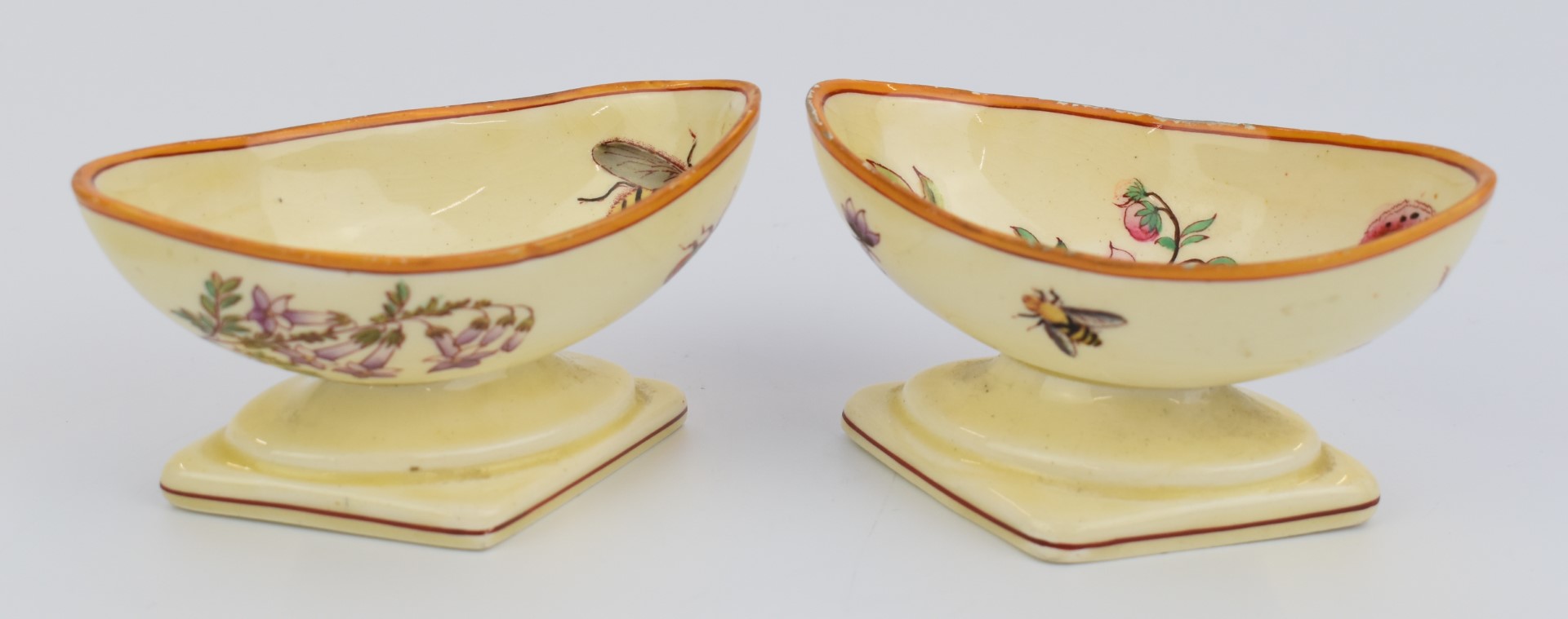 Pair of early 19thC Wedgwood creamware pedestal oval salts decorated with flowers and insects