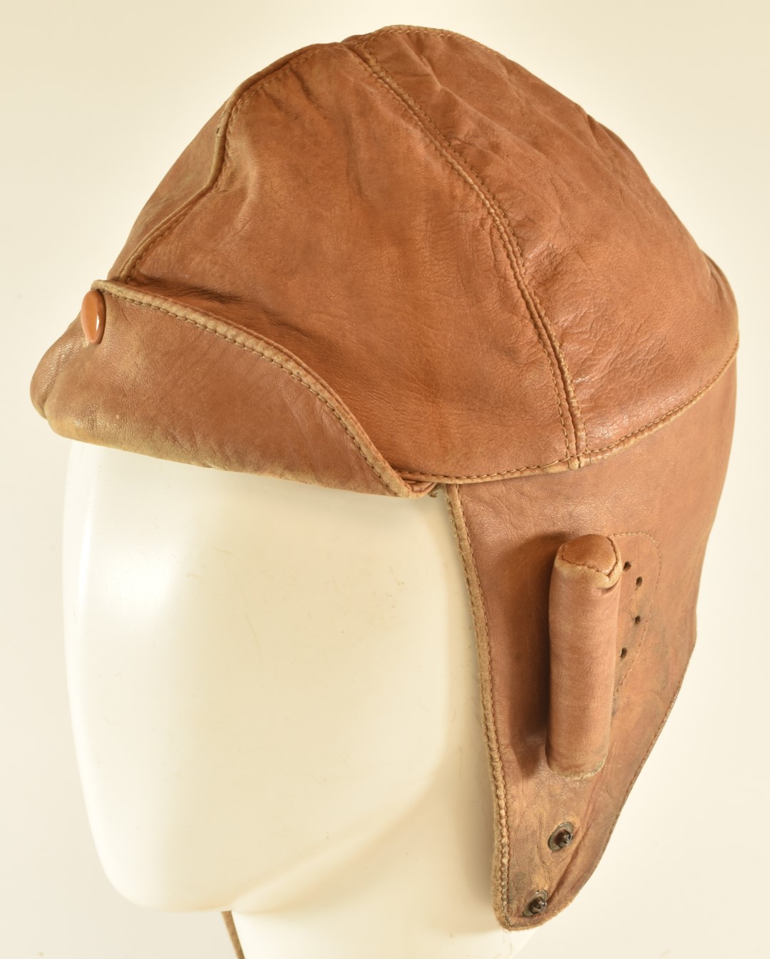 Leather flying helmet, wool lined, with perforated ear sections and protective pads