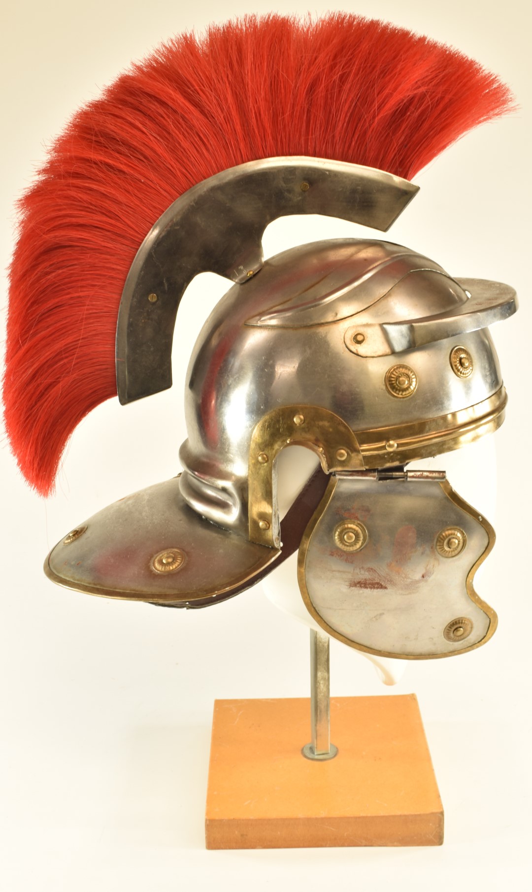 Replica Roman Centurion's steel helmet with red plume, brass edging and rosettes and leather lining. - Image 3 of 7