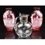A pair of Victorian Mary Gregory cranberry glass vases and a Hukin & Heath whisky jug with silver