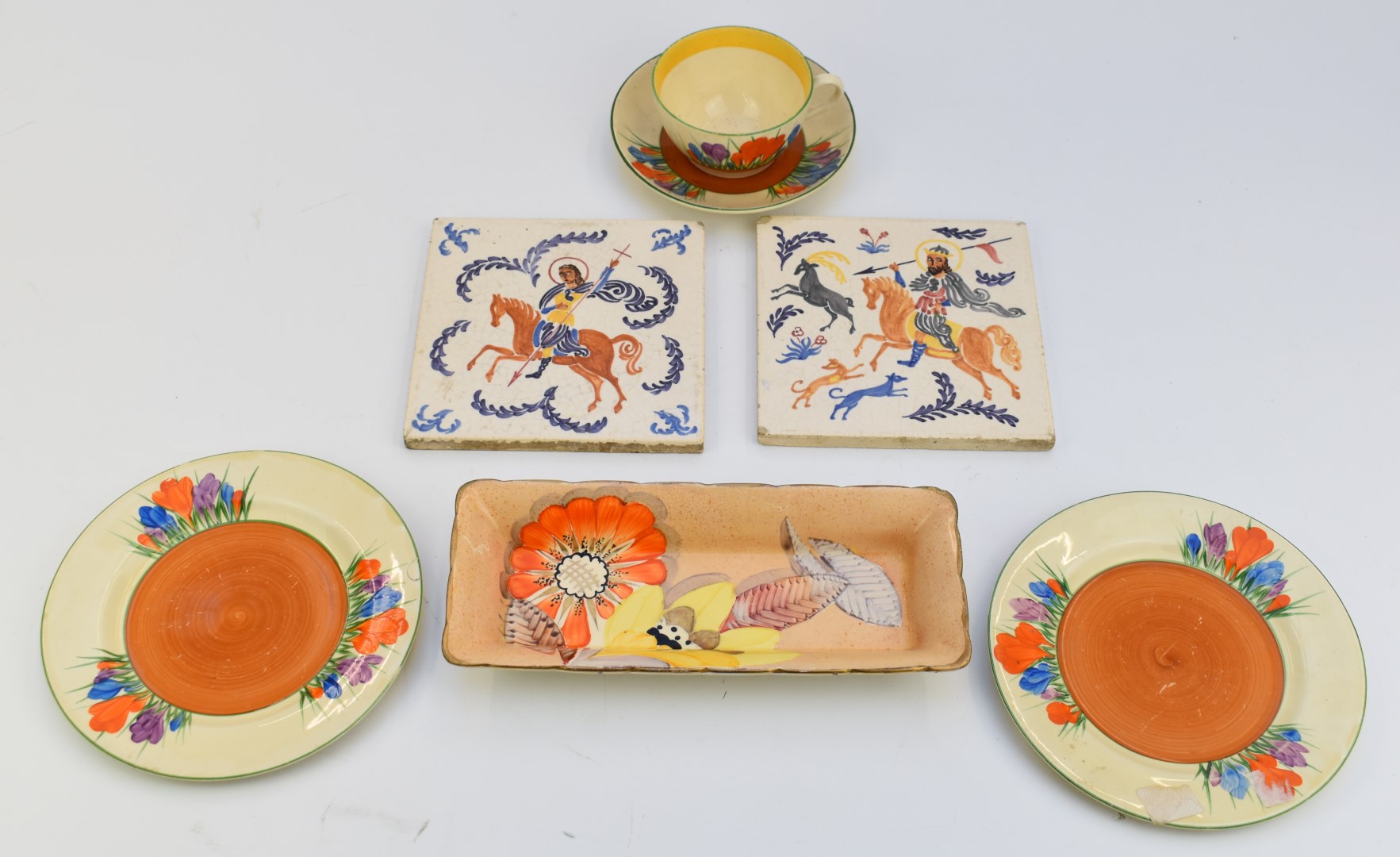 Clarice Cliff for Newport Pottery trio decorated in the Crocus pattern, with additional tea plate,