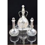 Ten glass decanters some 19thC with etched decoration of sailing ships, windmills, swallows, fruit