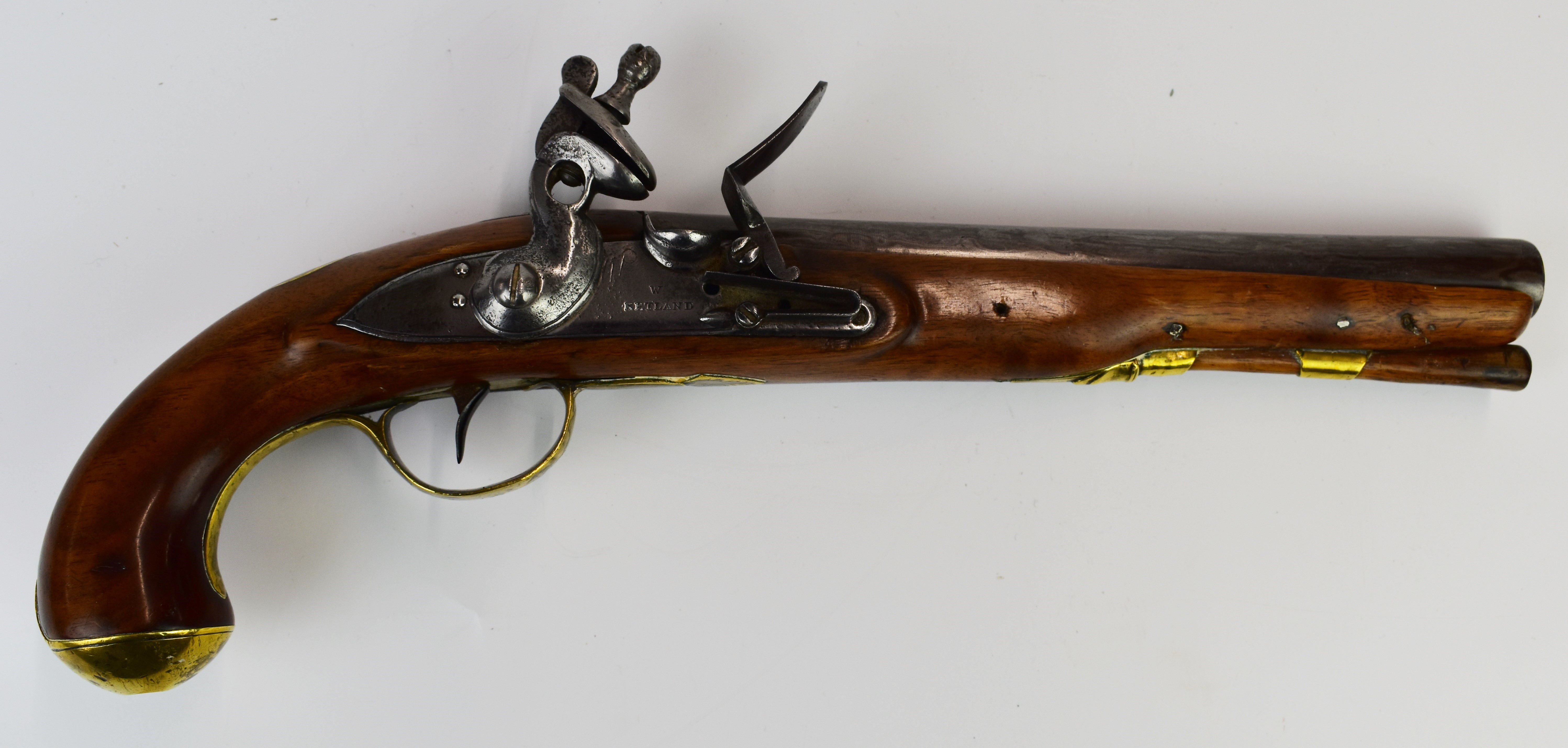 W Ketland & Co flintlock holster pistol with named and line engraved lock, brass trigger guard, butt