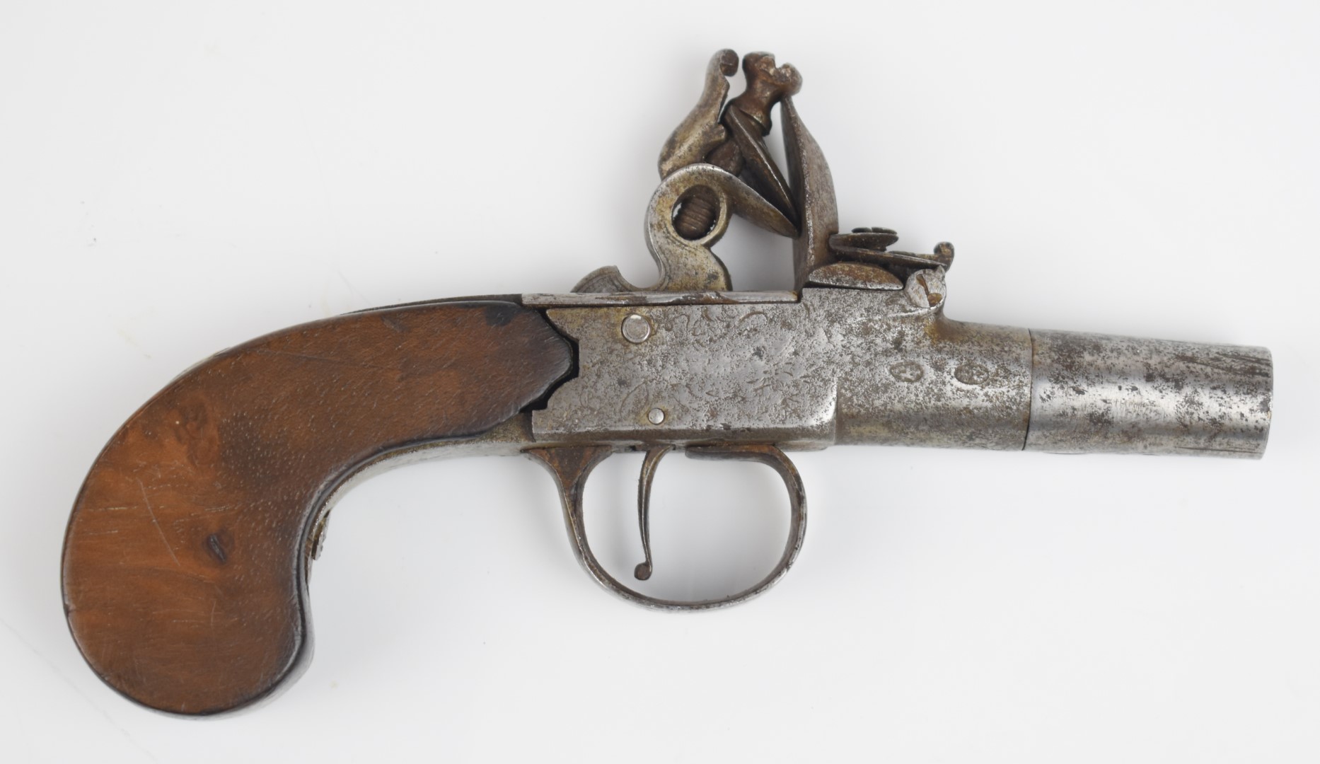 Indistinctly named flintlock pocket pistol with engraved lock and hammer, vacant shield shaped