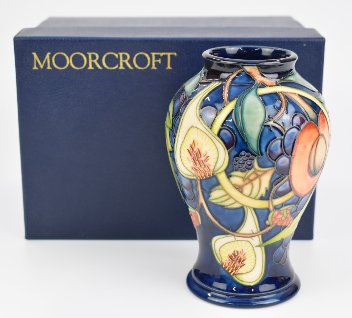 Moorcroft baluster pedestal vase decorated in the Queen's Choice pattern, dated 2001, height 16.5cm