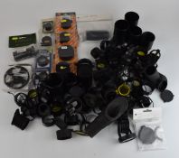 A large collection of air rifle or similar scope covers, tubes, lenses and accessories including