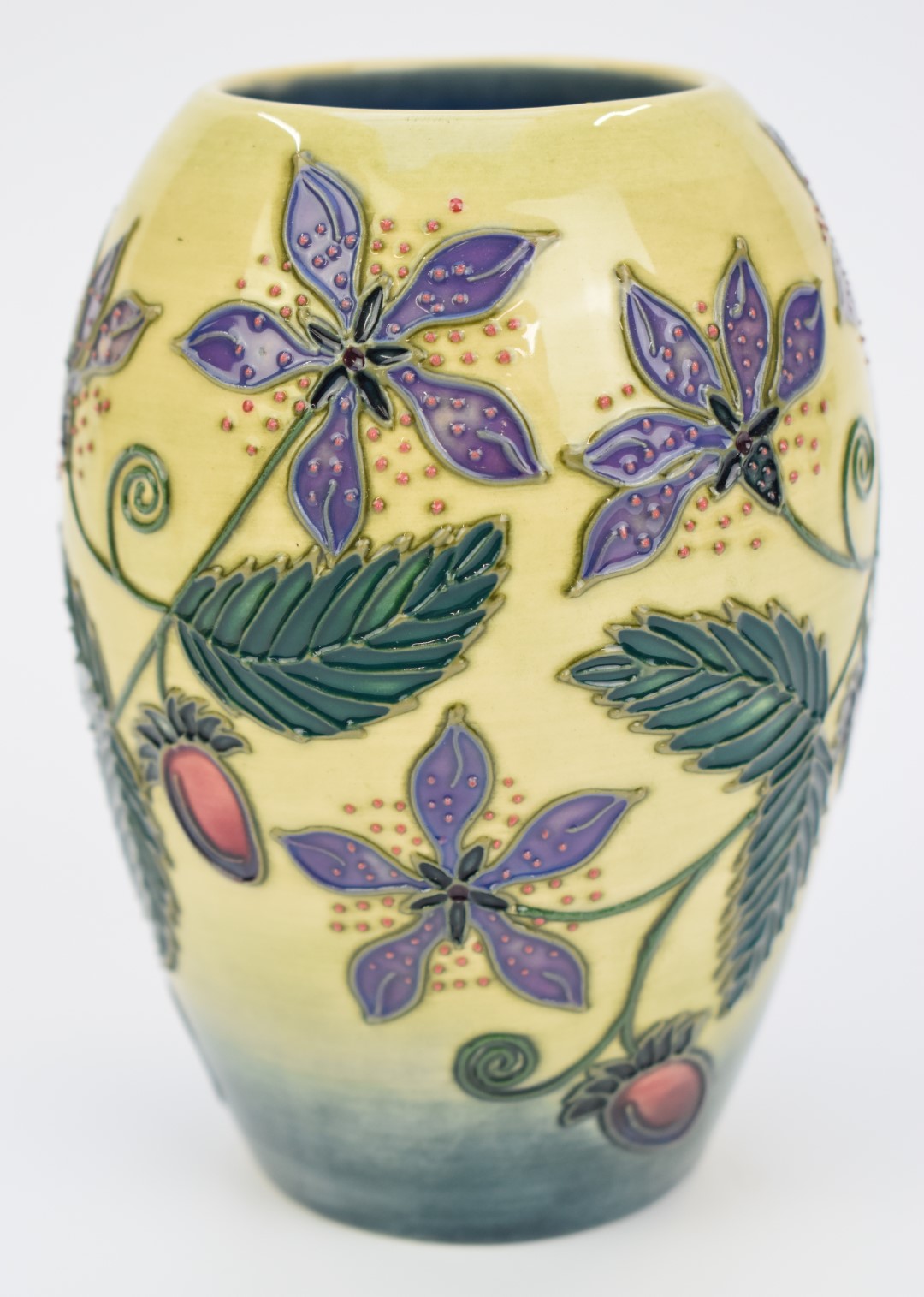 Moorcroft trial vase decorated with flowers and berries, height 14cm