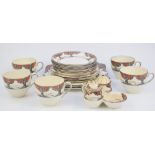 Twenty one pieces of Crown Ducal tea ware decorated in the Orange Tree pattern, includes cruet and