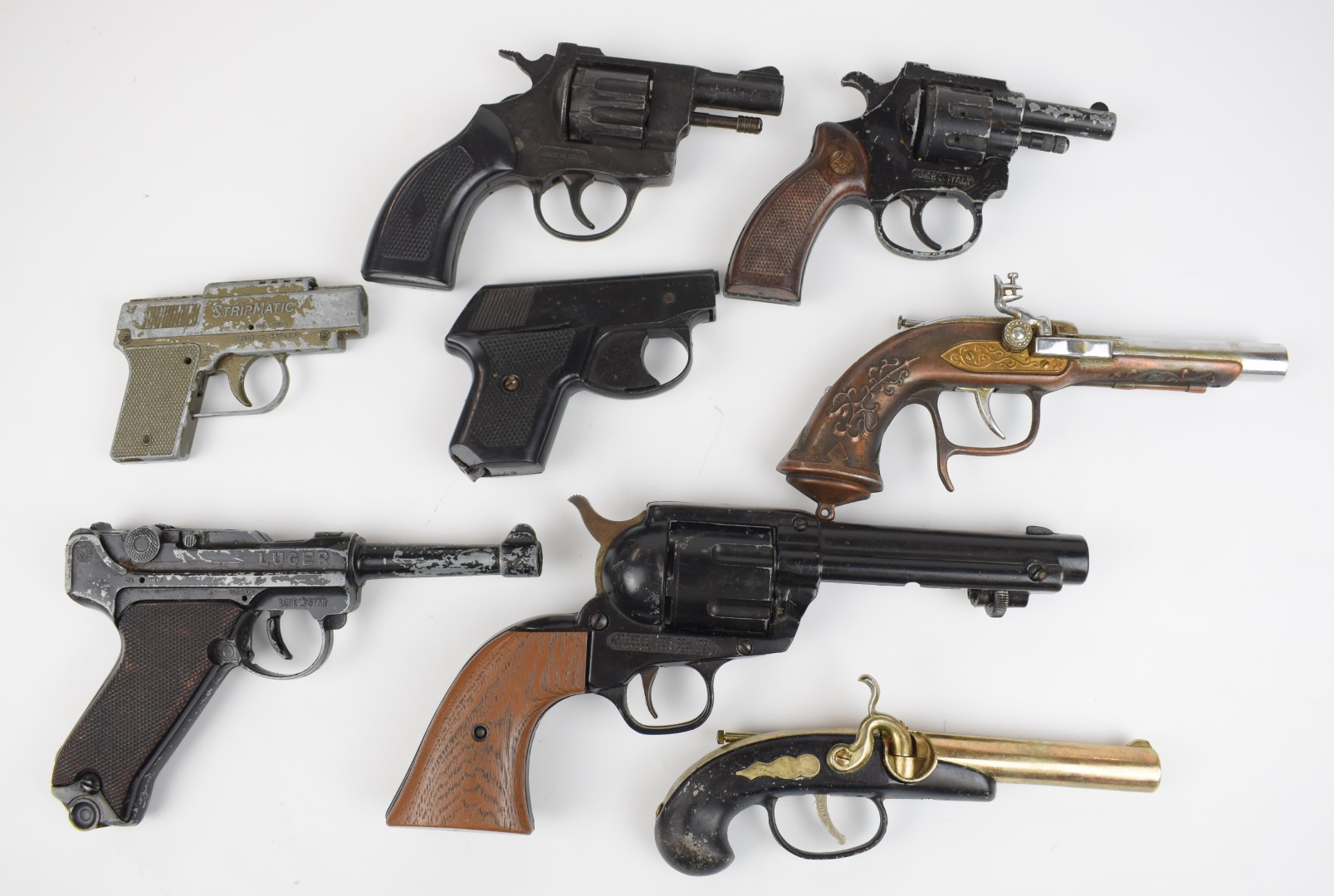 Eight replica or blank firing pistols and revolvers including Luger, StripMatic etc.