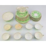 Thirty four pieces of 19thC Copeland tea ware decorated with relief moulded garlands against a green