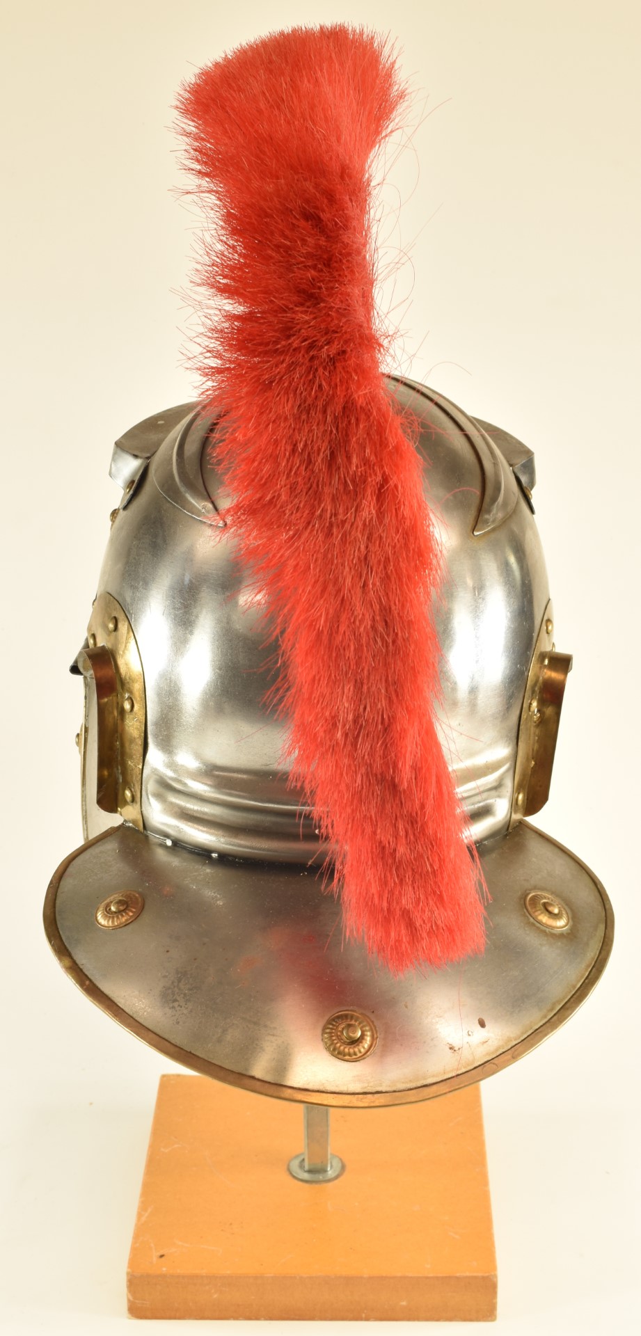 Replica Roman Centurion's steel helmet with red plume, brass edging and rosettes and leather lining. - Image 6 of 7