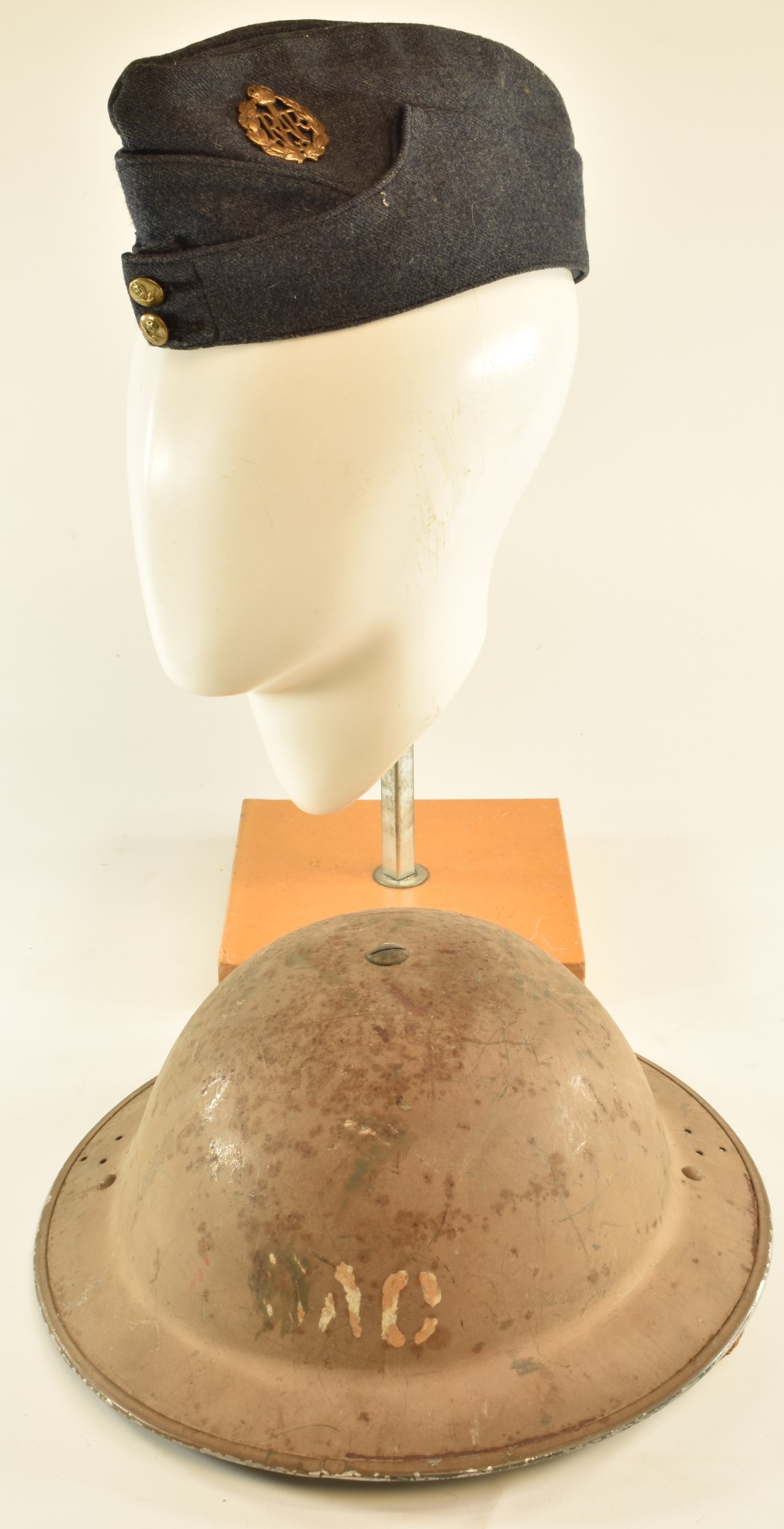 Royal Air Force regulation side hat / cap with brass badge together with a 'Brodie' steel helmet