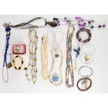 A collection of costume jewellery including mother of pearl earrings, gold plated bracelet, lapis