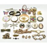 A collection of costume jewellery including brooches, rolled gold bangle, silver brooches, Miracle