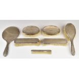 Hallmarked silver mounted dressing table items comprising hand mirror, five brushes and comb