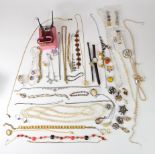 A collection of costume jewellery including vintage earrings, lucite brooches, diamanté, silver