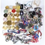 A collection of costume jewellery including necklaces, brooches, compacts, etc