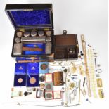 A collection of jewellery and medallions including Delft brooch, beads, bone necklace, glasses,