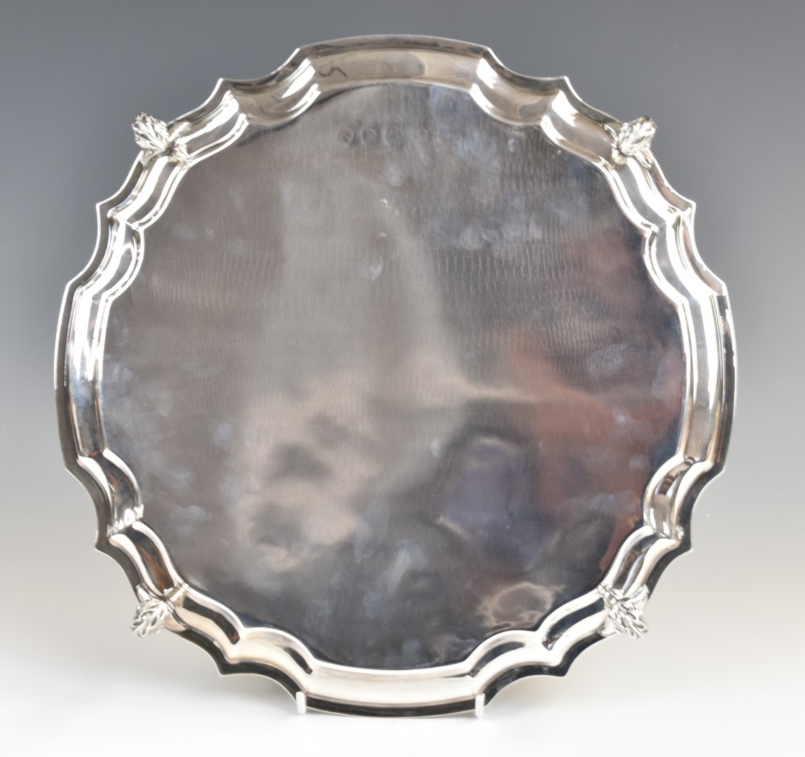 Elizabeth II hallmarked silver salver with shaped edge, raised on four scroll feet, London 1977 J - Image 2 of 4