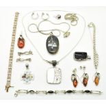 A collection of silver jewellery including tennis bracelet, silver curb link bracelet, a pair of