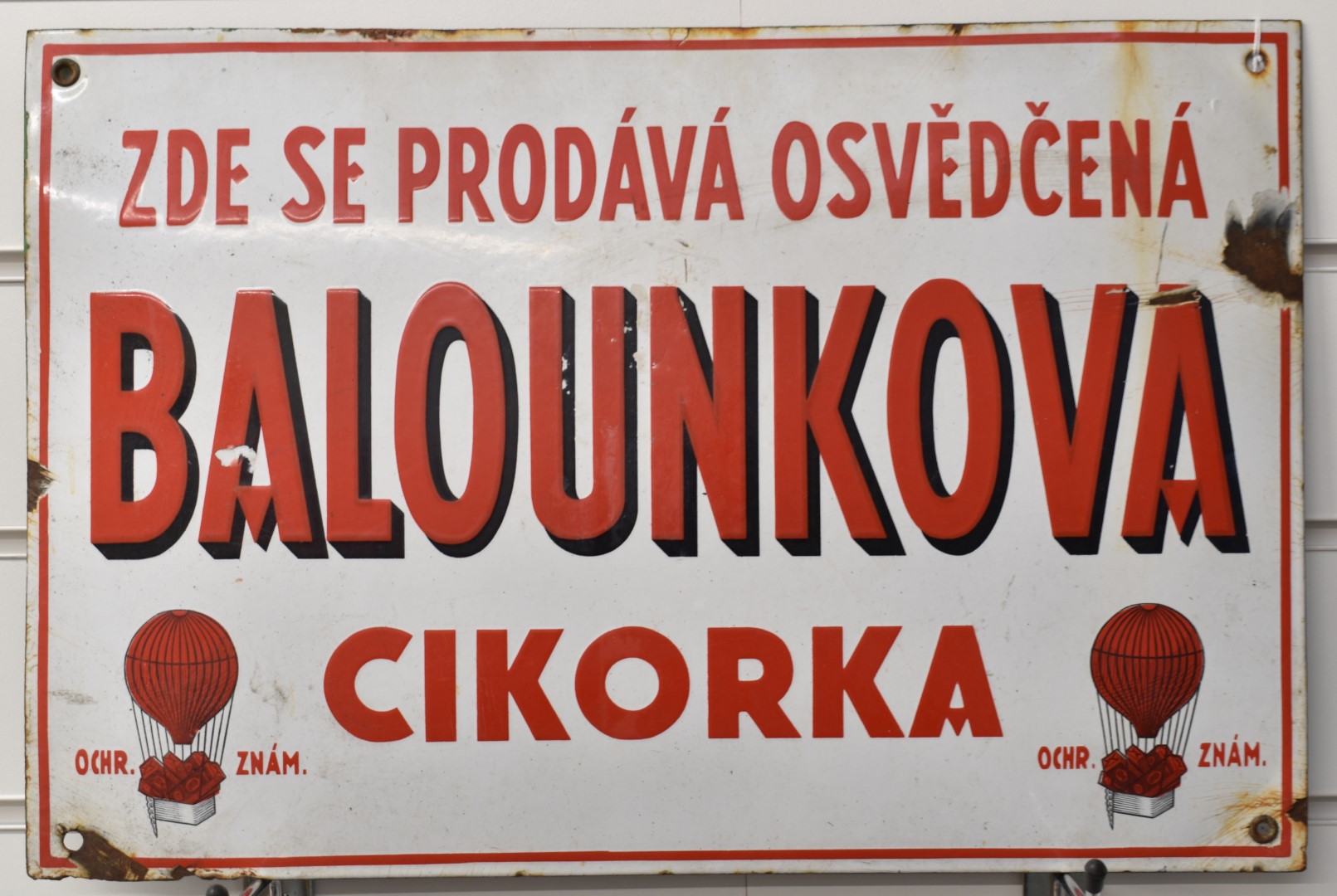 Vintage Czechoslovakian enamel advertising sign for Balounkova, with balloons to lower corners, 30 x