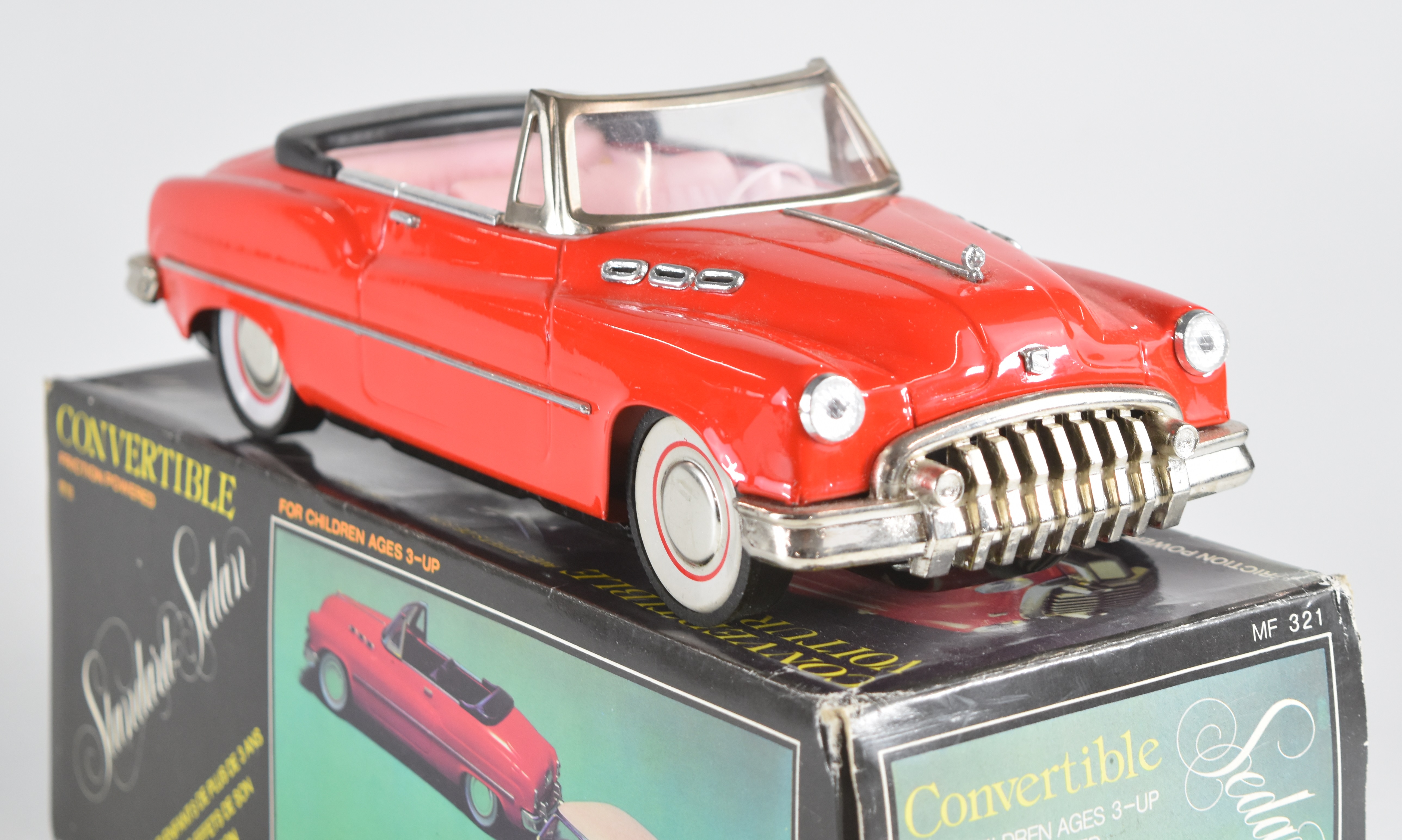 Five American style friction and clockwork tinplate cars including Cadillacs, all in original - Image 9 of 10