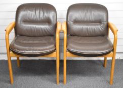 Two Kusch+Co. light oak, leather upholstered armchairs, please note the photograph shows an