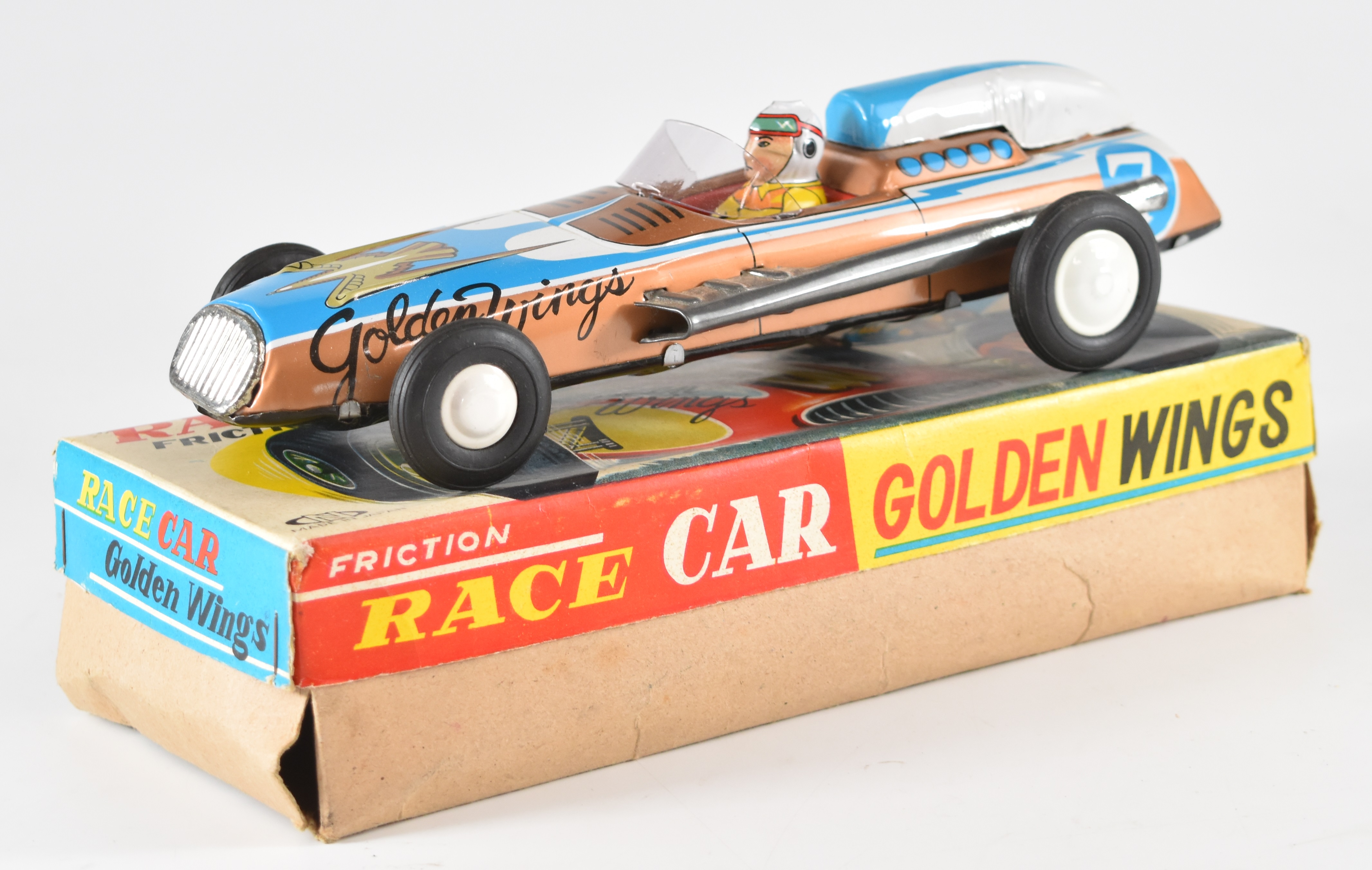 Golden Wings Japanese tinplate friction race car in original box.