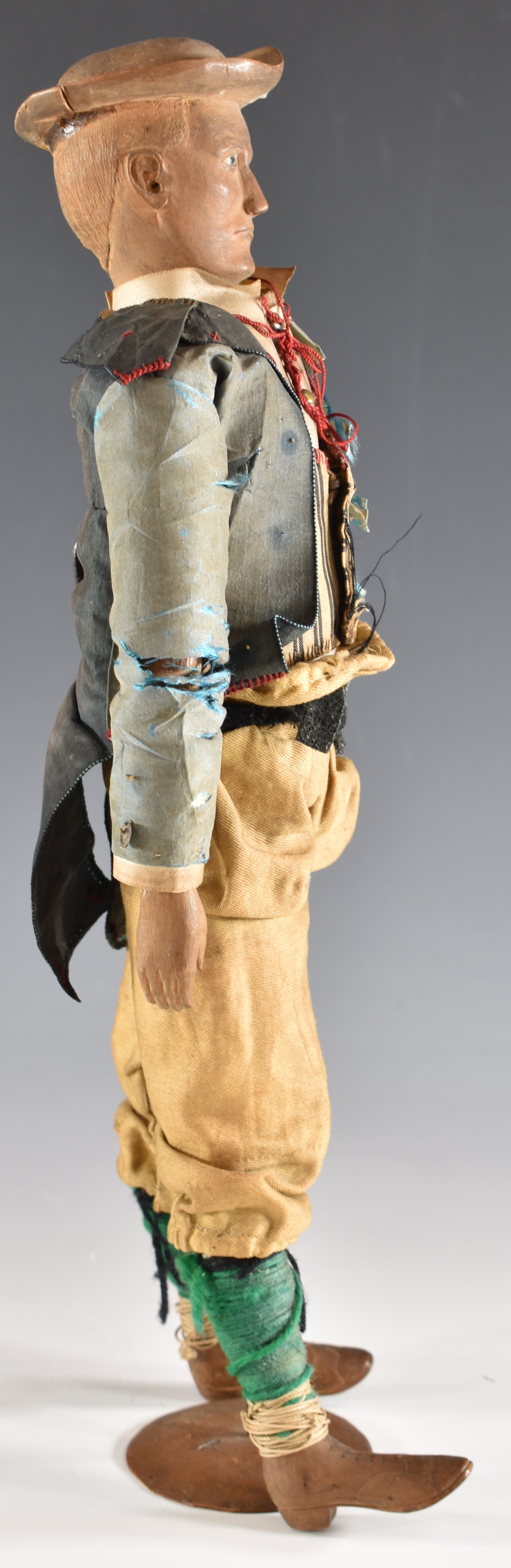 19thC carved wooden doll/ lay figure with articulated limbs, silk jacket and wooden boots, - Image 3 of 4