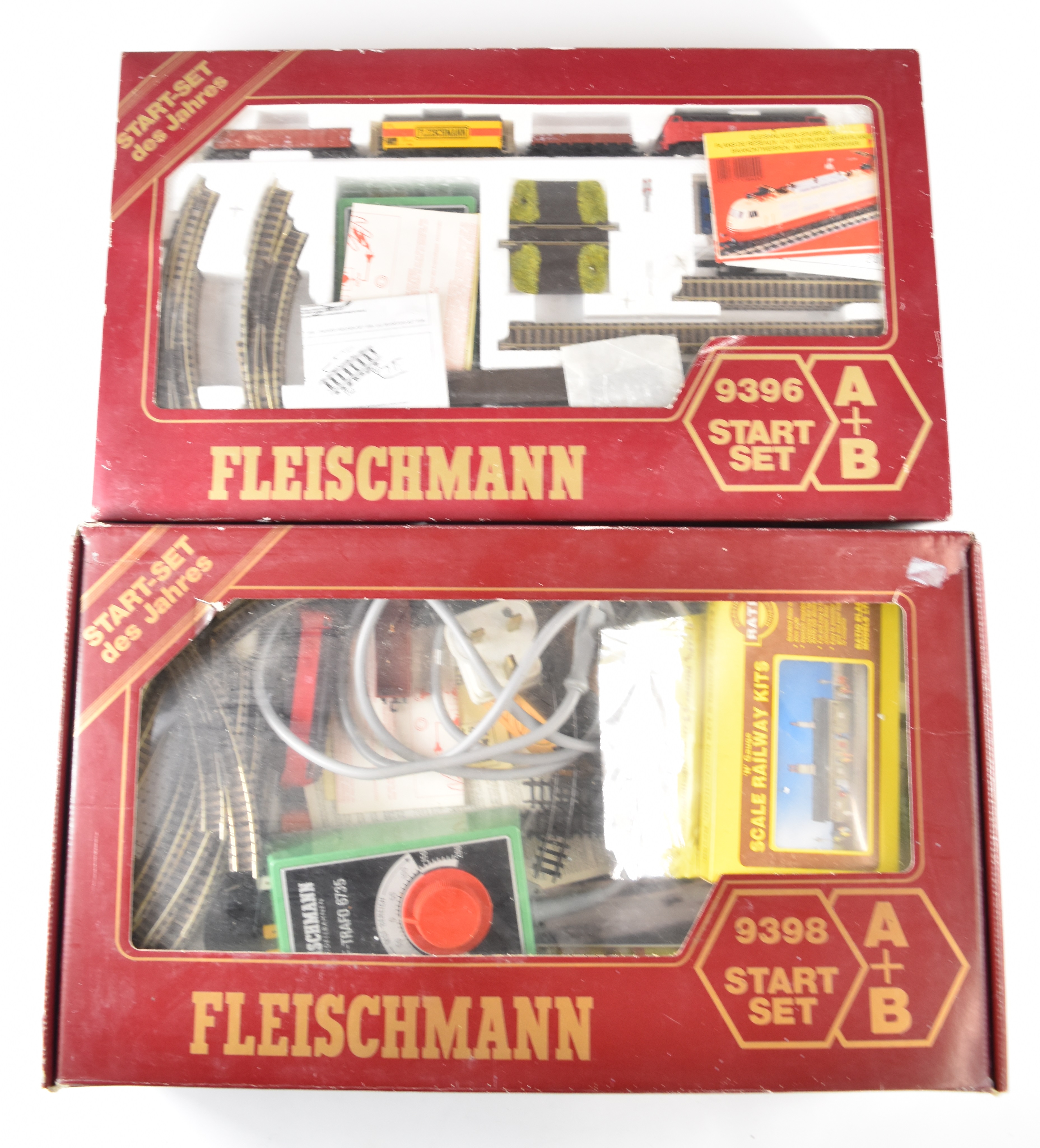 Two Fleischmann N gauge model railway 9396 sets, each including DB diesel locomotive and goods