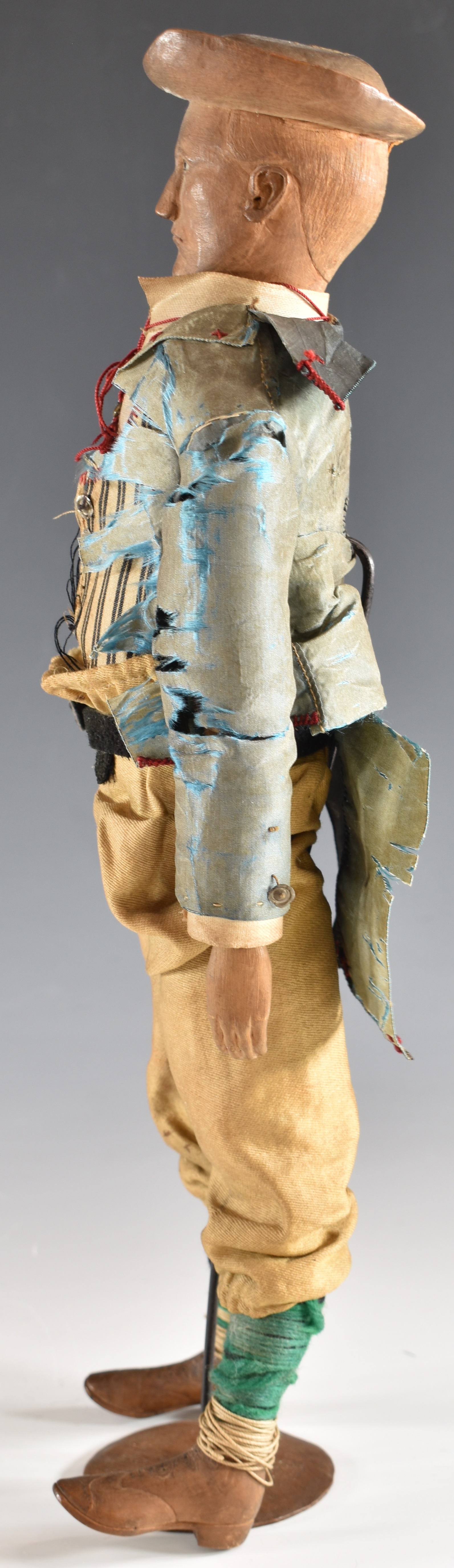 19thC carved wooden doll/ lay figure with articulated limbs, silk jacket and wooden boots, - Image 4 of 4