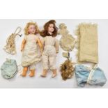 Two Armand Marseille bisque headed dolls comprising one with weighted blue eyes, open mouth,