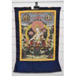 Tibetan 19th / 20thC scroll picture on silk depicting a deity, 57 x 39cm