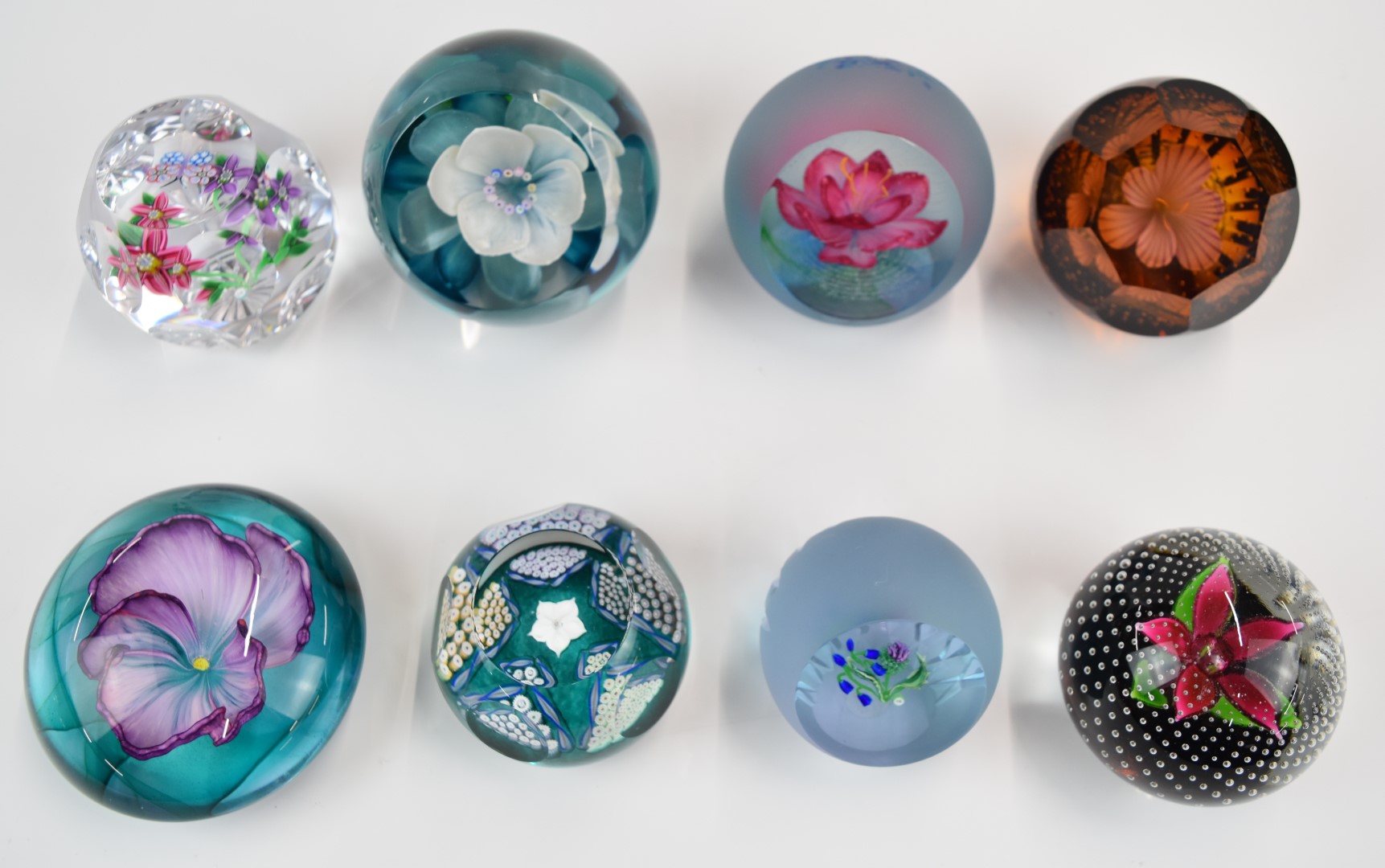 Eight Caithness glass paperweights comprising Butterfly Dream, Highland Spray, Waterlily