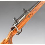 Potter & Walker .308 bolt-action rifle with laminated show wood stock, chequered semi-pistol grip