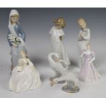 A collection of Lladro and Nao figures, tallest 24cm