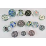 Fifteen Murano, Nason & Co and similar millefiori and other glass paperweights, one a faceted