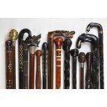 Fifteen walking sticks / canes including African tribal and Indian and Chinese interest with
