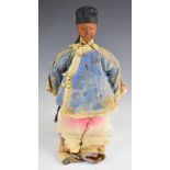 Chinese 'Door of Hope' girl doll wearing blue silk jacket, pink trousers, with bound feet and