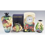 Three Moorcroft vases and a clock, tallest 16cm