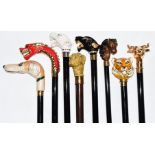 Eight walking sticks / canes with horse, dog and wild animal handles